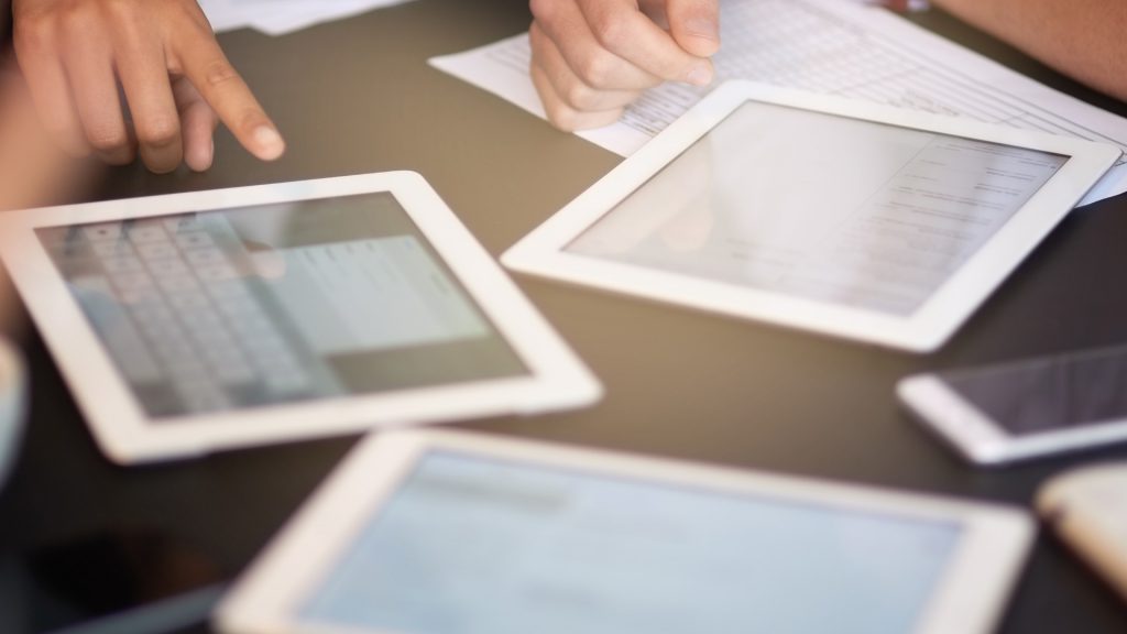 a team syncs their tablets