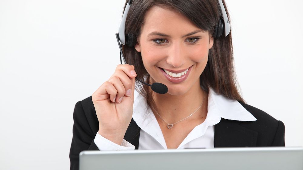Sales rep using headset | Are Sales Enablement Tools Necessary? | Linkpoint360