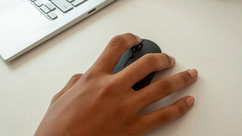 Close up of person's hand on a computer mouse | Linkpoint360