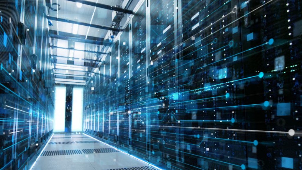 Glowing, blue lines dash across a hall of data servers | clean data | Linkpoint360