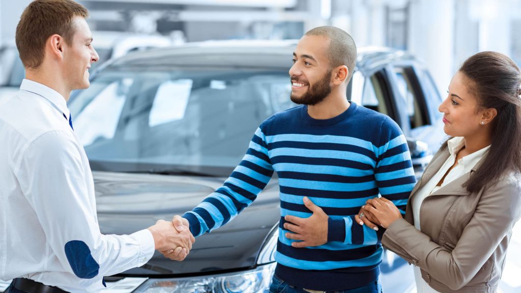 Salesperson Shakes Hand of Buyer as He Closes Deal on a Car | AI and Sales Enablement
