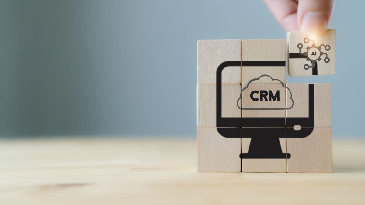 Wooden Blocks Form Computer Icon With CRM Written on Display | What is CRM Integration?