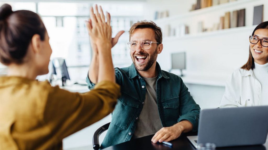 Salesperson high-fives manager after they implement LinkPoint360 | Top 10 Salesforce Tips