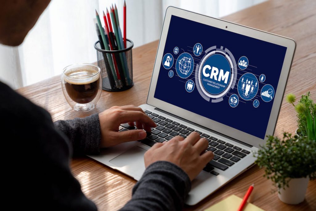 Man using a CRM on a laptop | CRM statistics