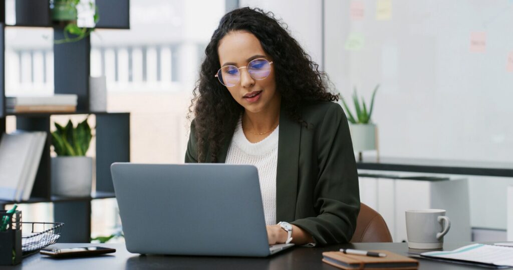 Salesforce admin working on a computer | Einstein Activity Capture pricing