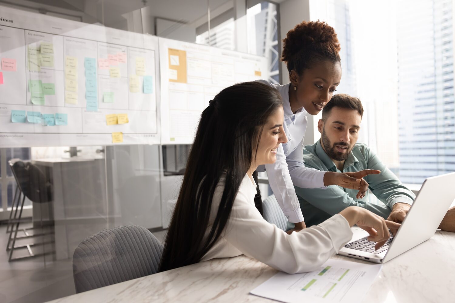 Sales team entering lead information on a laptop | Einstein Activity Capture pricing